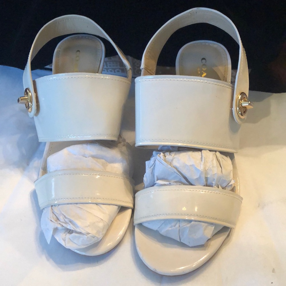 Moved Coach Marla patent leather brown tapered heel back gold tone lock strap